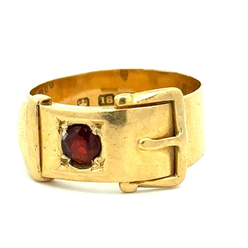 72 - A hallmarked 18ct gold and red stone buckle ring, size M. Weight 5.8g.
Please see the buyer's terms ... 