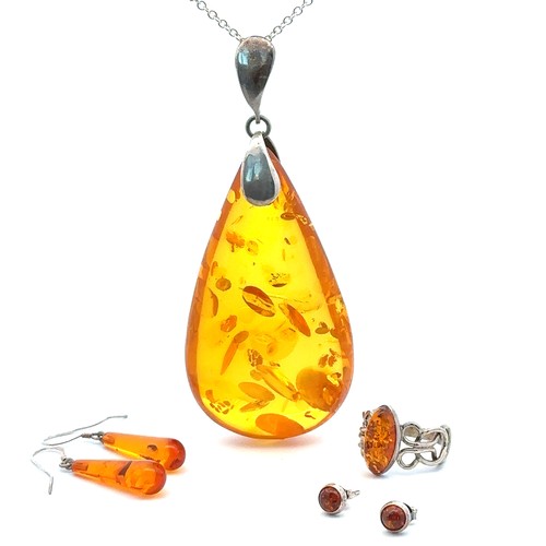 87 - A collection of amber and 925 jewellery items. Comprises of a  large amber pendant on chain, length ... 