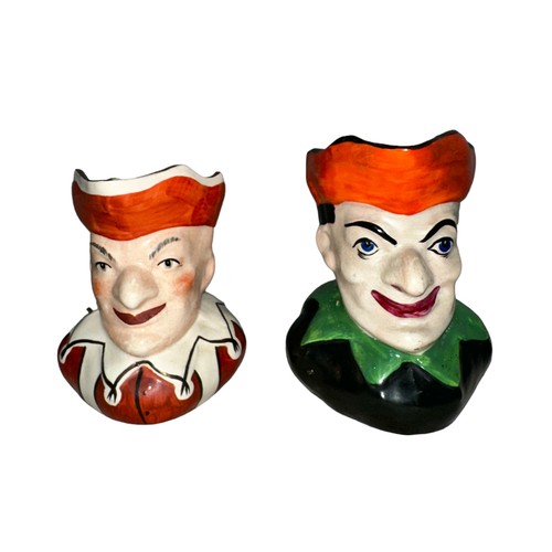 226 - Punch and Judy, pair of Punch & Judy hand painted ceramic jugs, two designs. Unmarked to base. Buyer... 