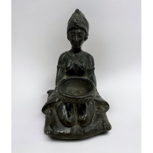 366 - A spelter statute of a kneeling woman holding a bowl.