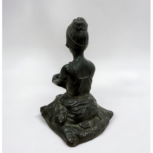 366 - A spelter statute of a kneeling woman holding a bowl.