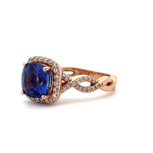 49 - Tanzanite and diamond rose gold ring, stamped BH 14K, size N. The cushion cut tanzanite, approx 8.13... 