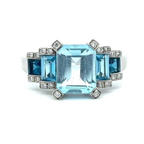 90 - A white gold five stone topaz and diamond ring by Amoro, size N.  The emerald cut central light blue... 