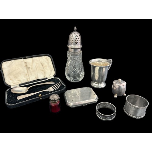 192 - A collection of hallmarked silver items. Items to include an inscribed silver cup , two napkin rings... 