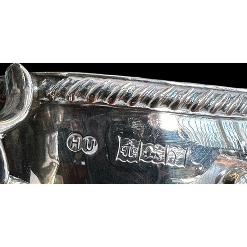 195 - Hampton Utilities, silver gravy boat with decorative handle and feet. Marked HU for Hampton Utilitie... 