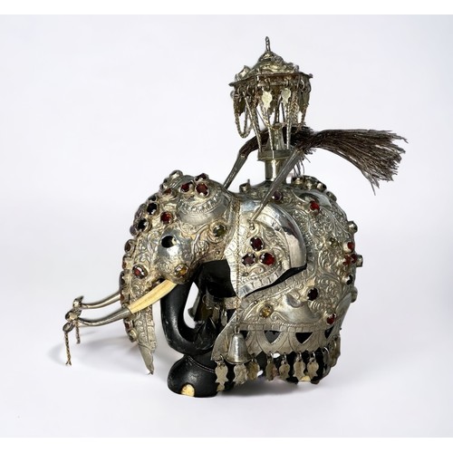 200 - A Sri Lankan silver and ebony Perahara elephant with howda.  Set with Ceylon gemstones and with bone... 