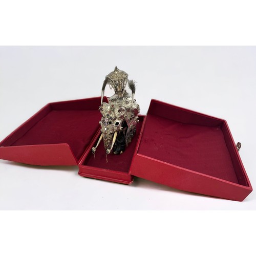 200 - A Sri Lankan silver and ebony Perahara elephant with howda.  Set with Ceylon gemstones and with bone... 