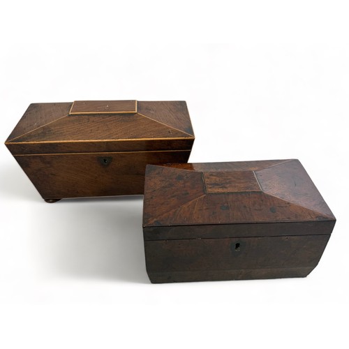 253 - Two wooden sarcopaghus style tea caddies. One with silver plated spoon and wooden mixing bowl