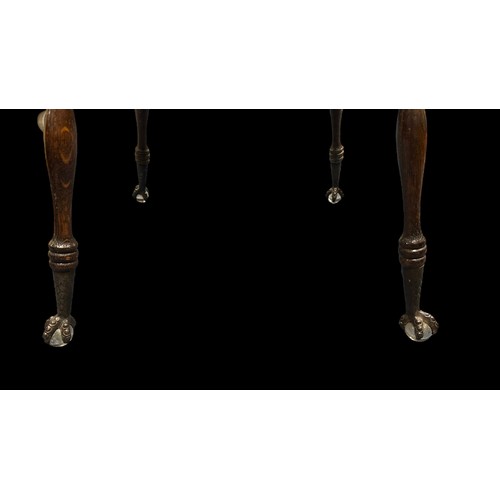 411 - Late 19th Century oak two-tier table, probably American, terminating on claw and glass ball feet. He... 