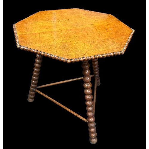 412 - A late 19th century Gipsy table, the octagonal top with beaded edge over the bobbin turned supports ... 