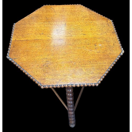 412 - A late 19th century Gipsy table, the octagonal top with beaded edge over the bobbin turned supports ... 