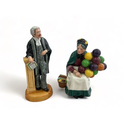 239 - Two Royal Doulton figurines - The Old Balloon Seller and The Lawyer.  Both in good condition,  tiny ... 