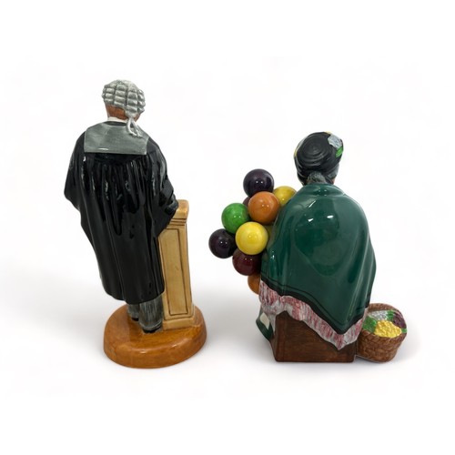 239 - Two Royal Doulton figurines - The Old Balloon Seller and The Lawyer.  Both in good condition,  tiny ... 