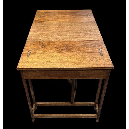 419 - An unusual mid-Century walnut metamorphic extending table. Folded 30x52.5cm, height 57cm, extended 9... 