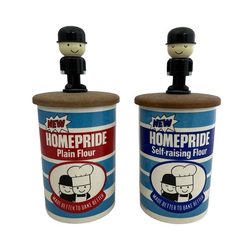 274 - Two Homepride flour storage jars along with a pair of 'Fred' salt and pepper shakers.