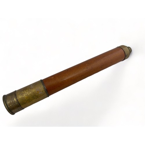 302 - A single draw Day or Night brass telescope by Jones of London. Approx 86cm when extended.