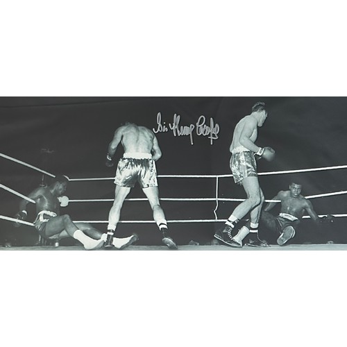 330 - A signed framed Sir Henry Cooper picture. The picture shows the moment Cassius Clay (later to be kno... 