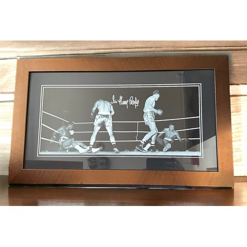 330 - A signed framed Sir Henry Cooper picture. The picture shows the moment Cassius Clay (later to be kno... 