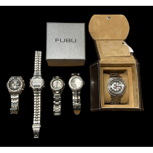 139 - A collection of 5 watches. Including a FUBU watch in a Chevy box, also replica Breitling watch, Clau... 