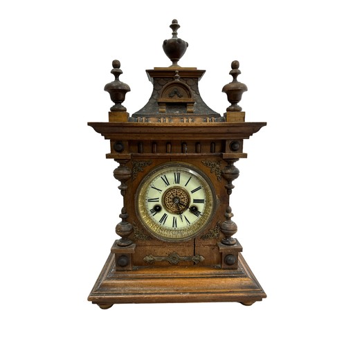 283 - An oak mantel clock with enamelled dial, with paper label to interior H.A.C. 14 day strike made in G... 