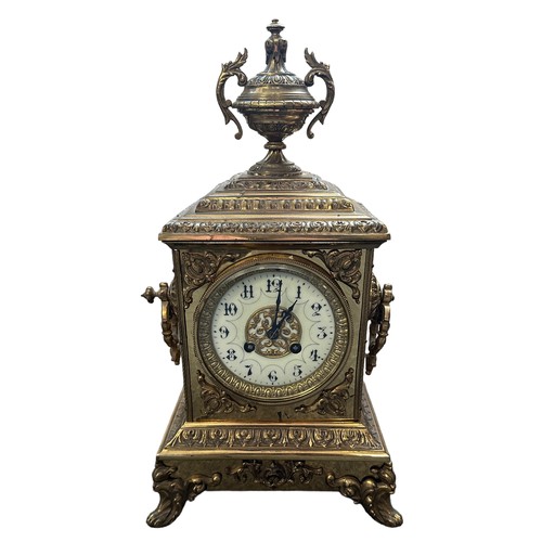 281 - A French ormolu style brass mantel clock with enamelled dial, height 40cm. In working order.