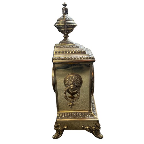 281 - A French ormolu style brass mantel clock with enamelled dial, height 40cm. In working order.