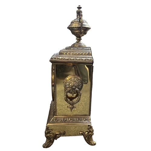 281 - A French ormolu style brass mantel clock with enamelled dial, height 40cm. In working order.