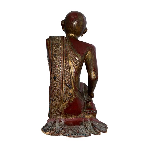 365 - Tibetan, carved wooden praying Sariputta Monk figure, red lacquer and gold finish with mirror and se... 