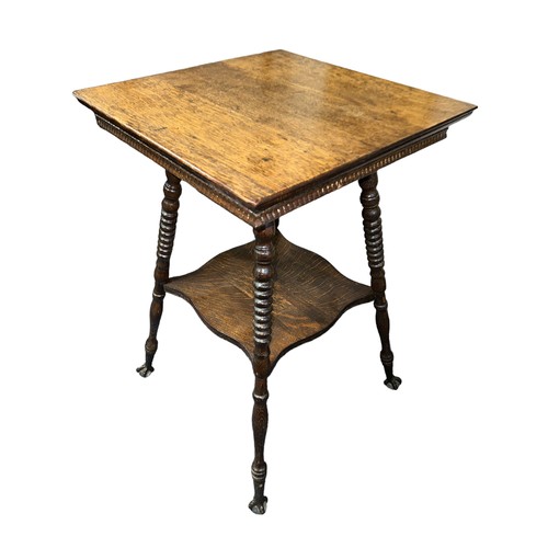 411 - Late 19th Century oak two-tier table, probably American, terminating on claw and glass ball feet. He... 