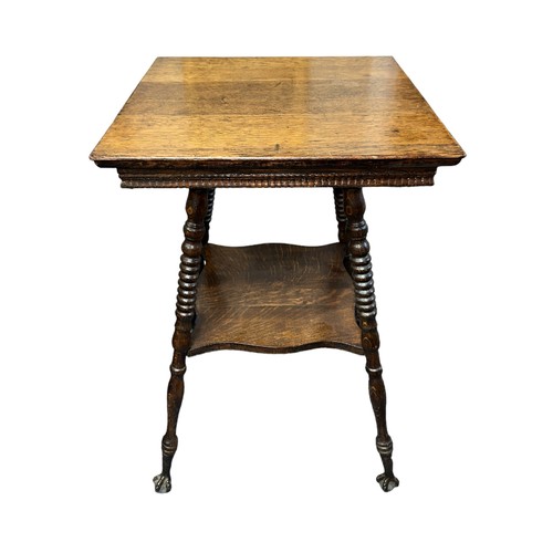 411 - Late 19th Century oak two-tier table, probably American, terminating on claw and glass ball feet. He... 