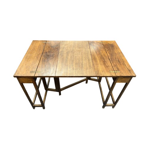 419 - An unusual mid-Century walnut metamorphic extending table. Folded 30x52.5cm, height 57cm, extended 9... 