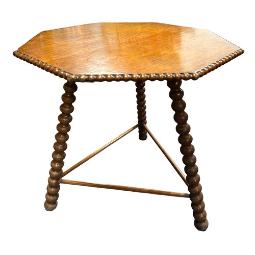 412 - A late 19th century Gipsy table, the octagonal top with beaded edge over the bobbin turned supports ... 