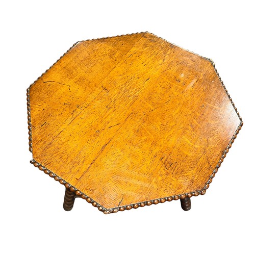 412 - A late 19th century Gipsy table, the octagonal top with beaded edge over the bobbin turned supports ... 