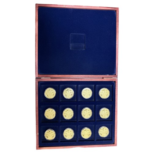 172 - Churchill set of 12 pictorial gold plated medallions, in wooden presentation case.