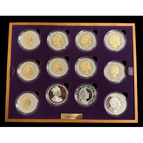 253 - Royal Mint, 2002 Golden Jubilee Collection. Sterling silver proof set, with 22 ct. gold plated detai... 