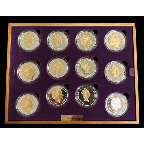 253 - Royal Mint, 2002 Golden Jubilee Collection. Sterling silver proof set, with 22 ct. gold plated detai... 