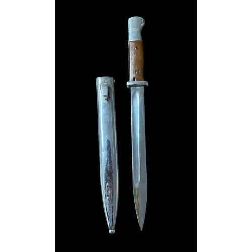 54 - Second World War, K98 bayonet with metal scabbard. Brown handle. Blade marked for ‘jwh’ & 693. Top o... 