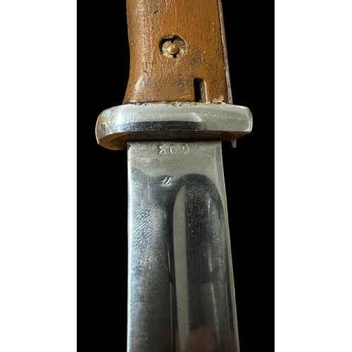 54 - Second World War, K98 bayonet with metal scabbard. Brown handle. Blade marked for ‘jwh’ & 693. Top o... 