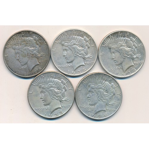 287 - USA range of silver dollars (5), in mixed condition with 1928, 1934 (2) and 1935 (2).