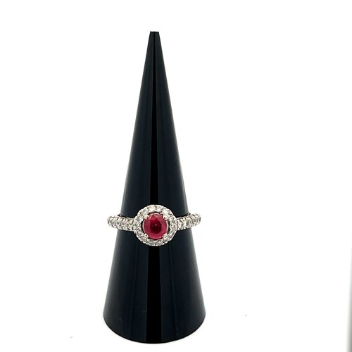 6 - A 14ct white gold ruby and diamond cluster ring, size M/N.  Ruby estimated at 0.6ct, estimated diamo... 