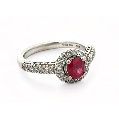 6 - A 14ct white gold ruby and diamond cluster ring, size M/N.  Ruby estimated at 0.6ct, estimated diamo... 