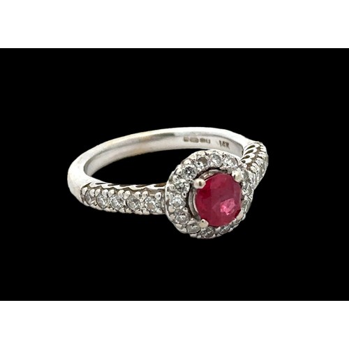 6 - A 14ct white gold ruby and diamond cluster ring, size M/N.  Ruby estimated at 0.6ct, estimated diamo... 