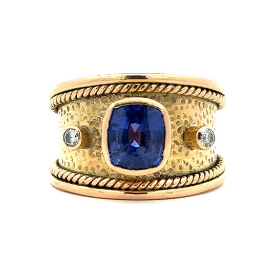 34 - A sapphire ring and diamond ring. A natural cushion cut sapphire approx 8mm x 7mm is set in unmarked... 