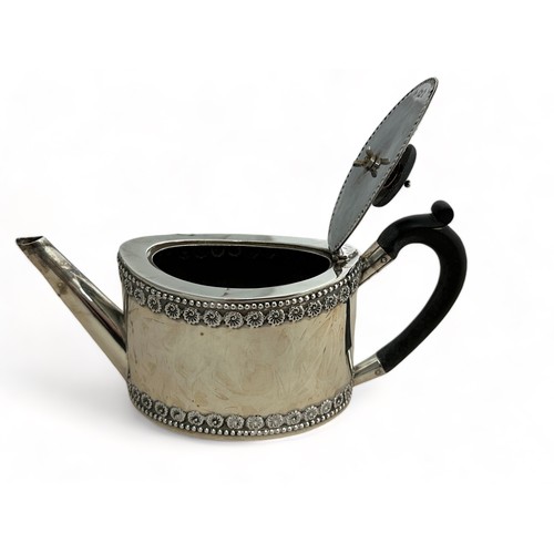 107 - A silver bachelor's teapot of straight sided oval form, ebonised wood handle and finial.  Fordham & ... 