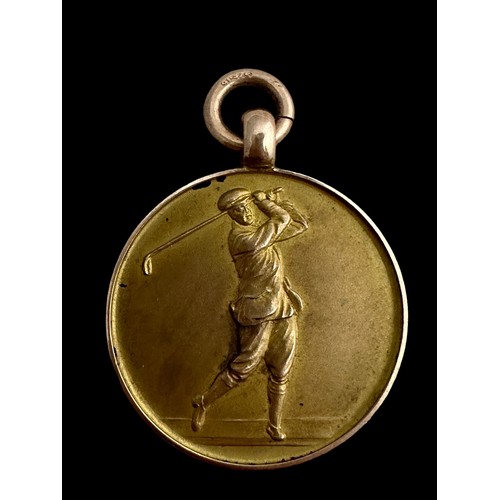 42 - A 9ct gold medallion on a yellow metal chain. Medallion with a profile of a golfer on one side and l... 