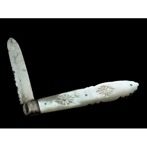 99 - A Victorian silver fruit knife with a mother of pearl handle.  Ornately decorated. Marks for Arthur ... 