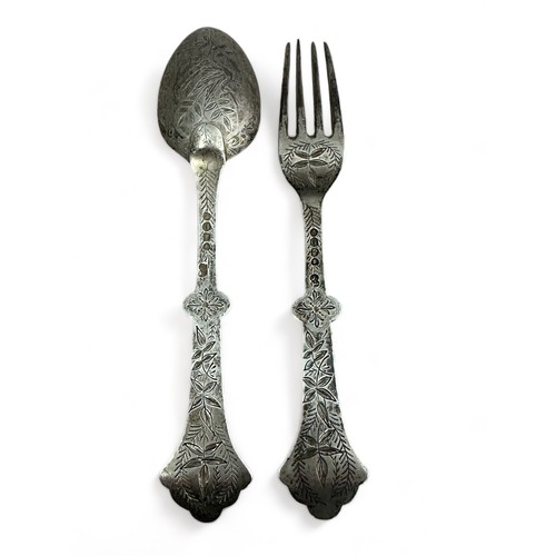 100 - A silver Christening fork and spoon decorated with a bird (stork?) and leaf design by Thomas Smily, ... 