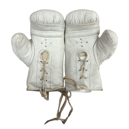 409 - Chris Eubank (British, b.1966), pair of signed white Lonsdale boxing gloves, signed by boxing legend... 