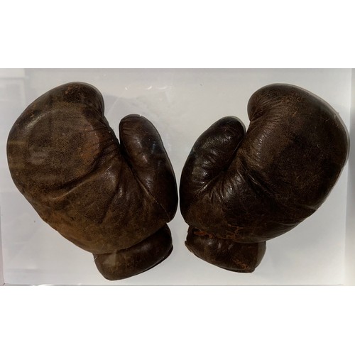 411 - Randolph Turpin (British, 1928-1966), framed pair of leather boxing gloves worn by Randolph Turpin i... 