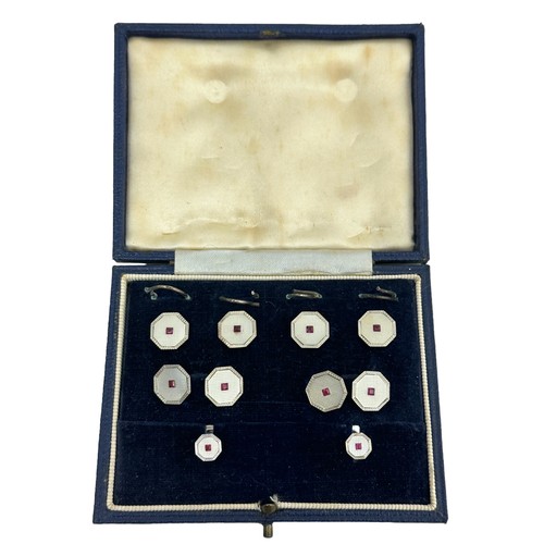 43 - A cased octagonal white gold, mother of pearl and ruby cufflinks, button and studs set, S J Rose & S... 